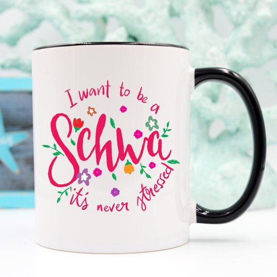 A stylish white ceramic mug featuring a vibrant design celebrating Speech Language Pathologists, available in 11 and 15 oz sizes.