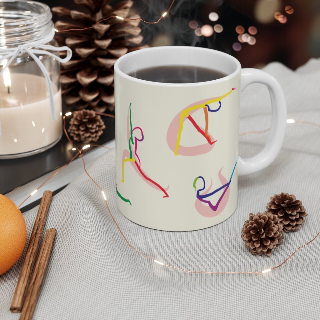 A white ceramic coffee mug featuring stick figure yoga poses, perfect for coffee, tea, or hot chocolate.