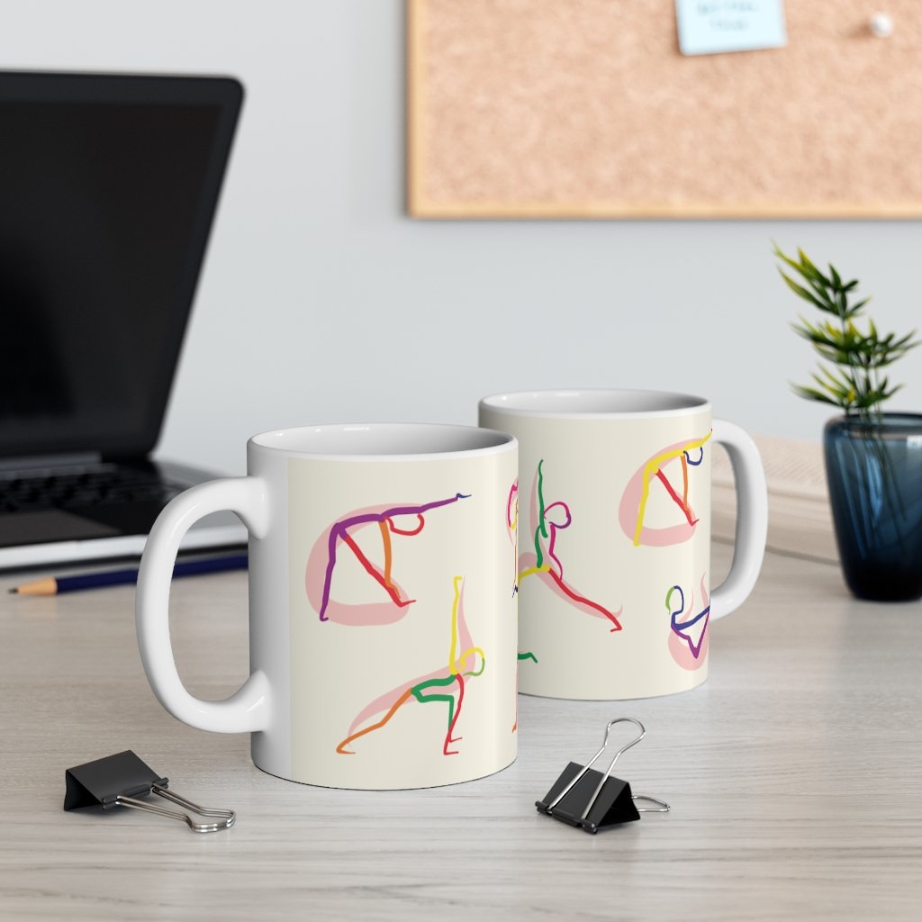 A white ceramic coffee mug featuring stick figure yoga poses, perfect for coffee, tea, or hot chocolate.