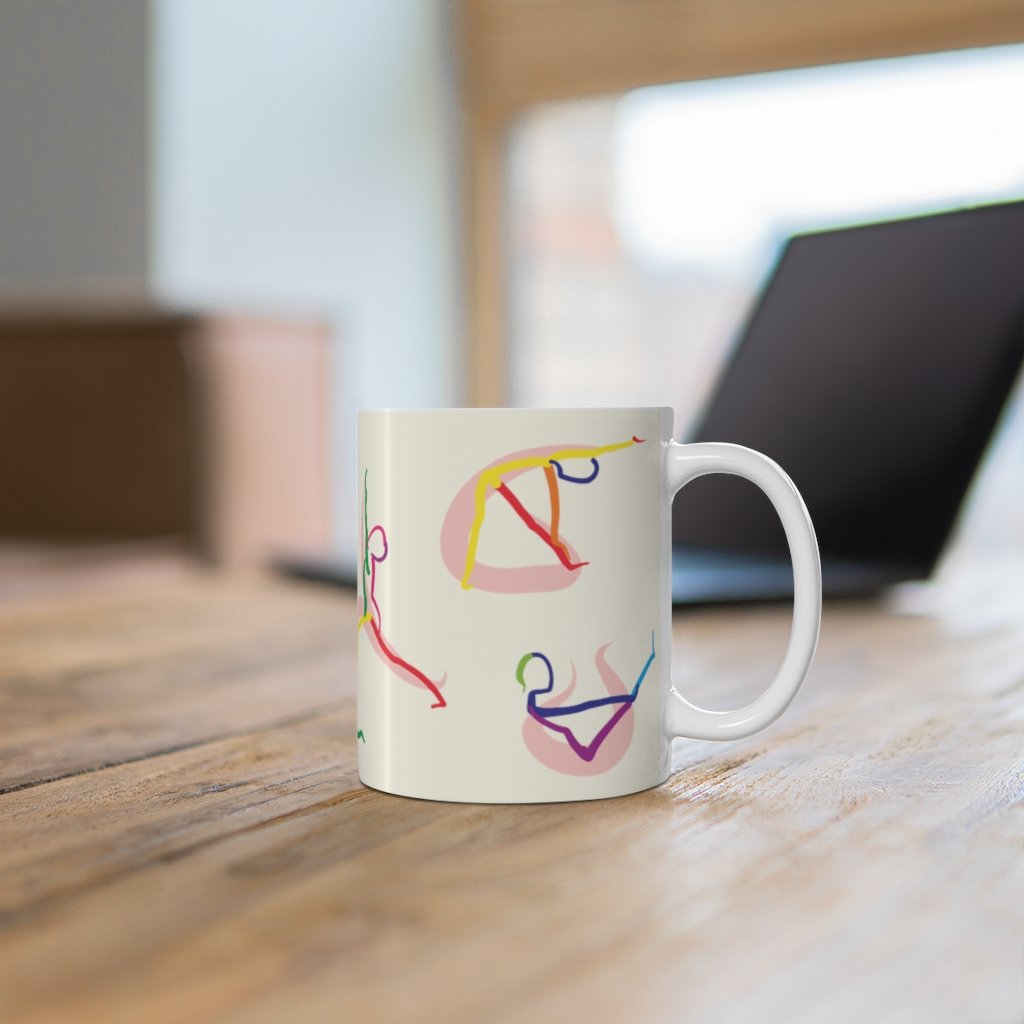 A white ceramic coffee mug featuring stick figure yoga poses, perfect for coffee, tea, or hot chocolate.