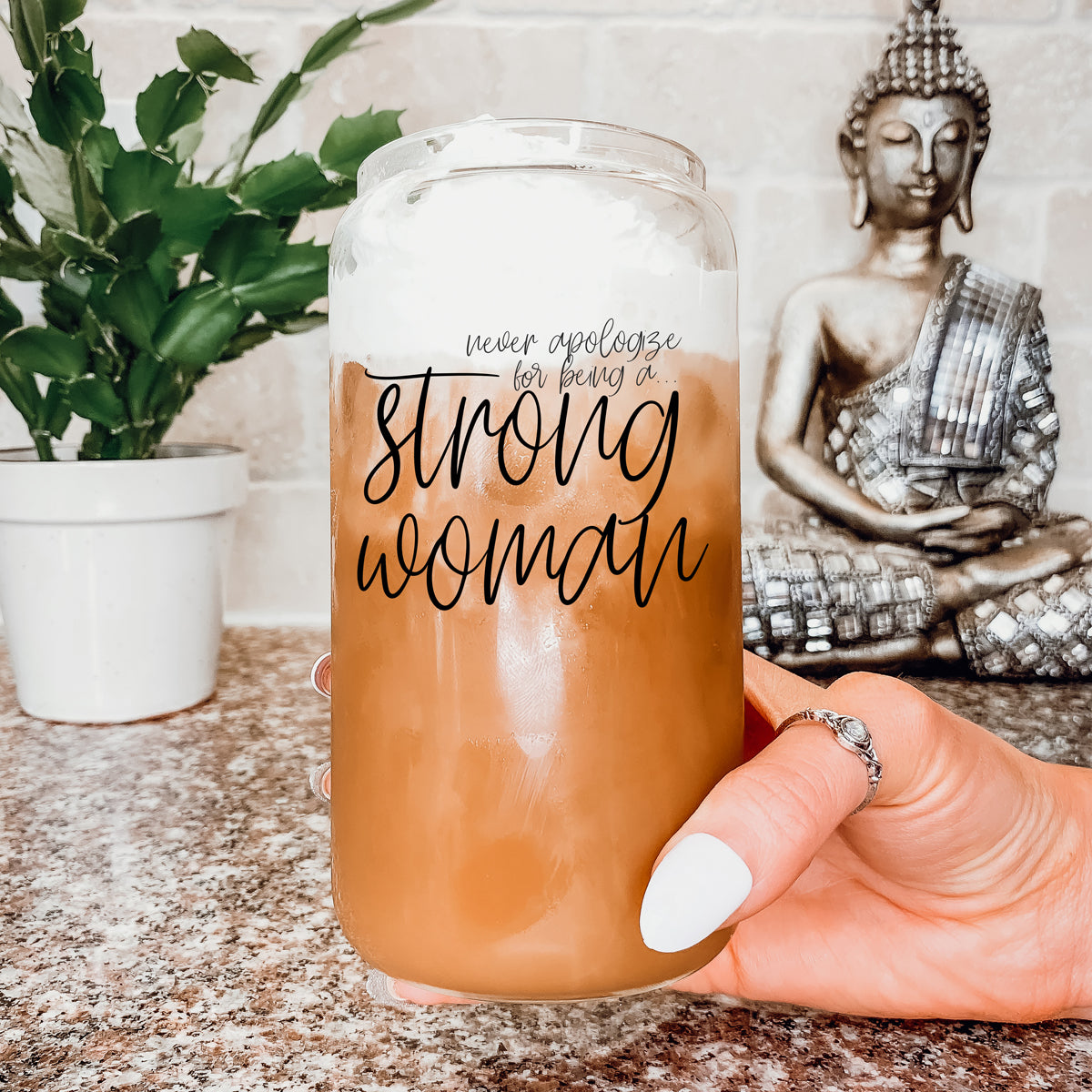 Strong Woman Set featuring glass drinking cups with bamboo lids and stainless steel straws, showcasing a stylish black graphic design.