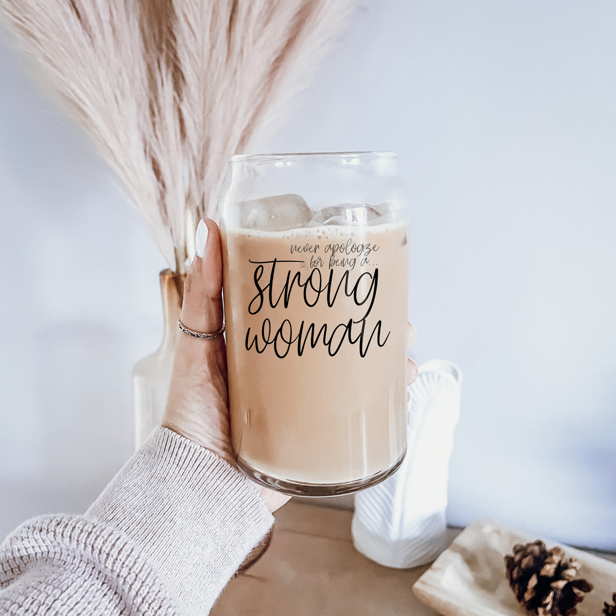 Strong Woman Set featuring glass drinking cups with bamboo lids and stainless steel straws, showcasing a stylish black graphic design.