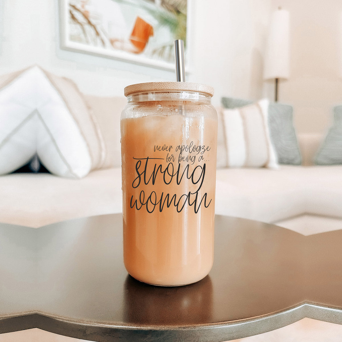 Strong Woman Set featuring glass drinking cups with bamboo lids and stainless steel straws, showcasing a stylish black graphic design.