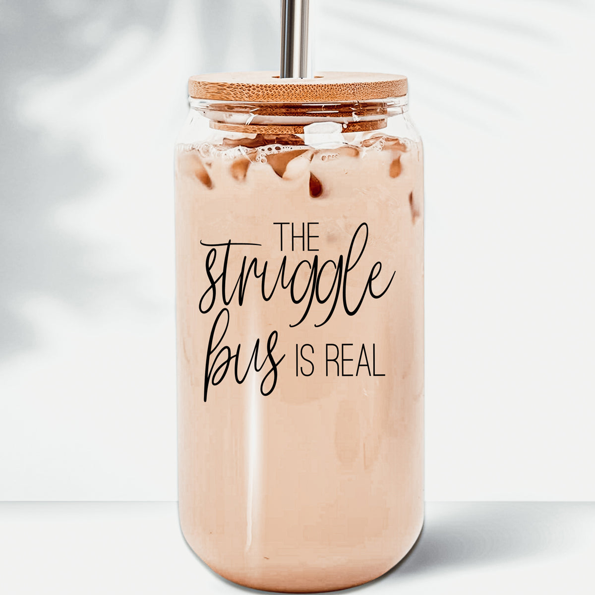 Struggle Bus Set featuring glass drinking cups with bamboo lids and stainless steel straws, ideal for various beverages.