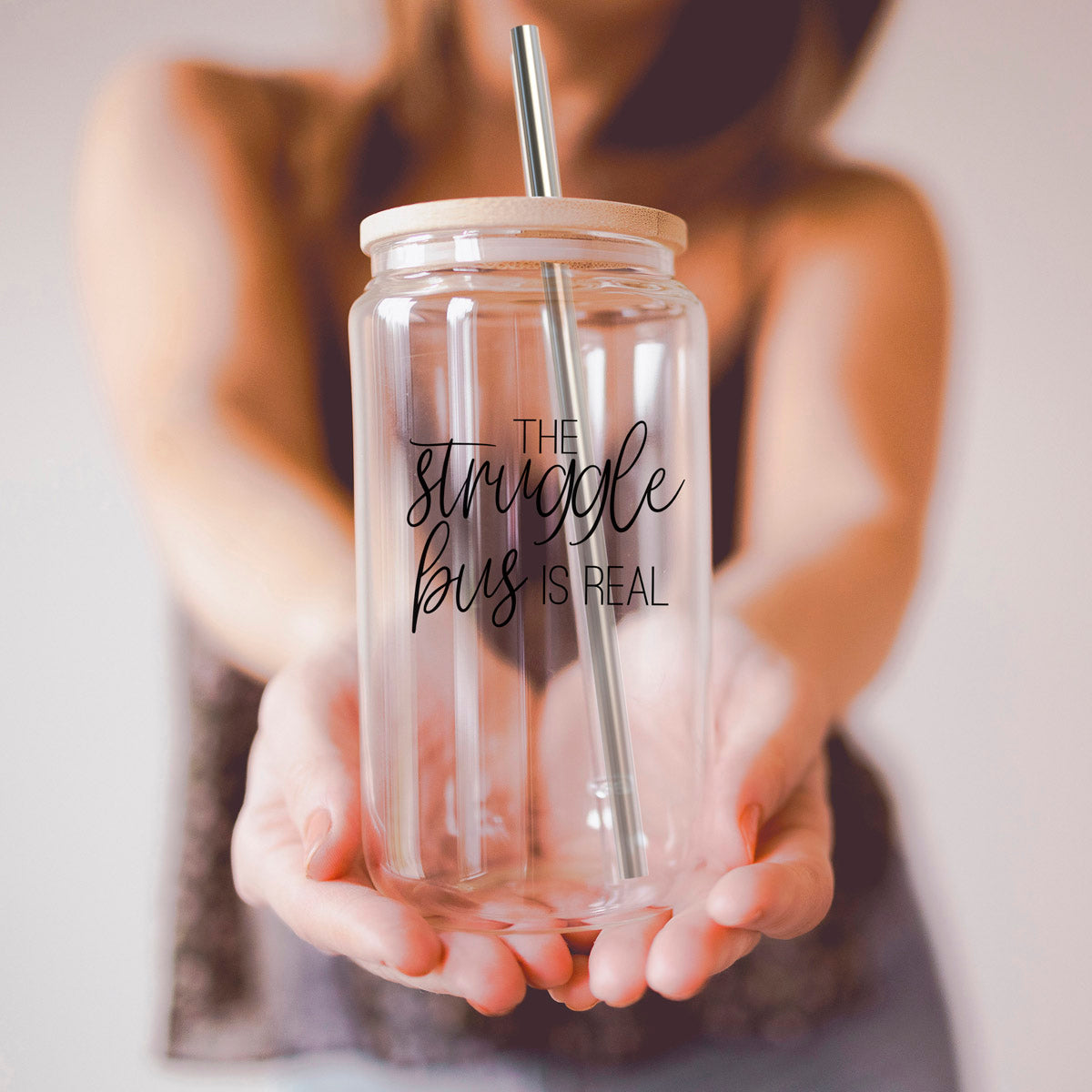 Struggle Bus Set featuring glass drinking cups with bamboo lids and stainless steel straws, ideal for various beverages.