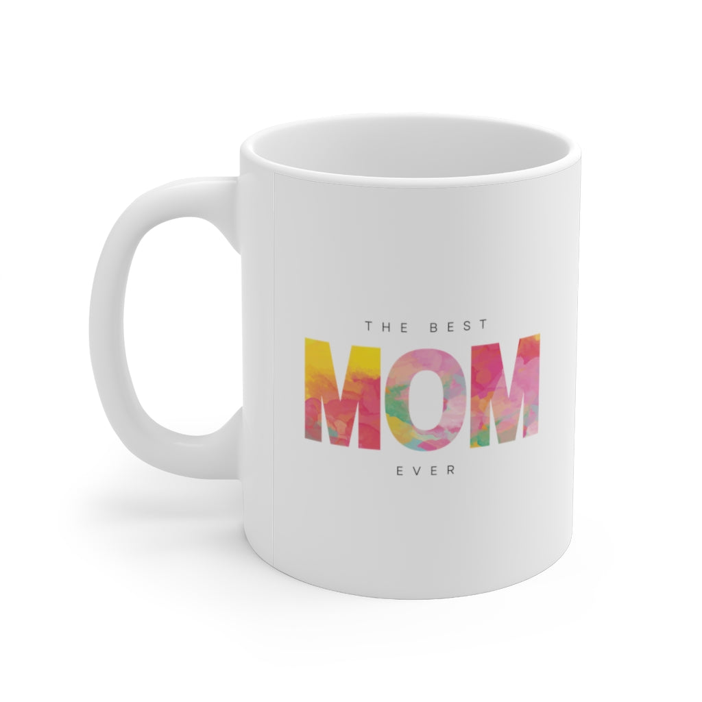 A white ceramic mug with 'The Best Mom' printed on it, featuring a C-handle and rounded corners, ideal for coffee or tea.