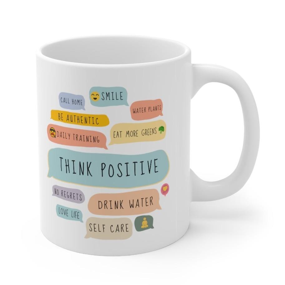 A white ceramic mug featuring positive quotes, perfect for coffee and tea lovers, showcasing its durable design and 11-ounce capacity.