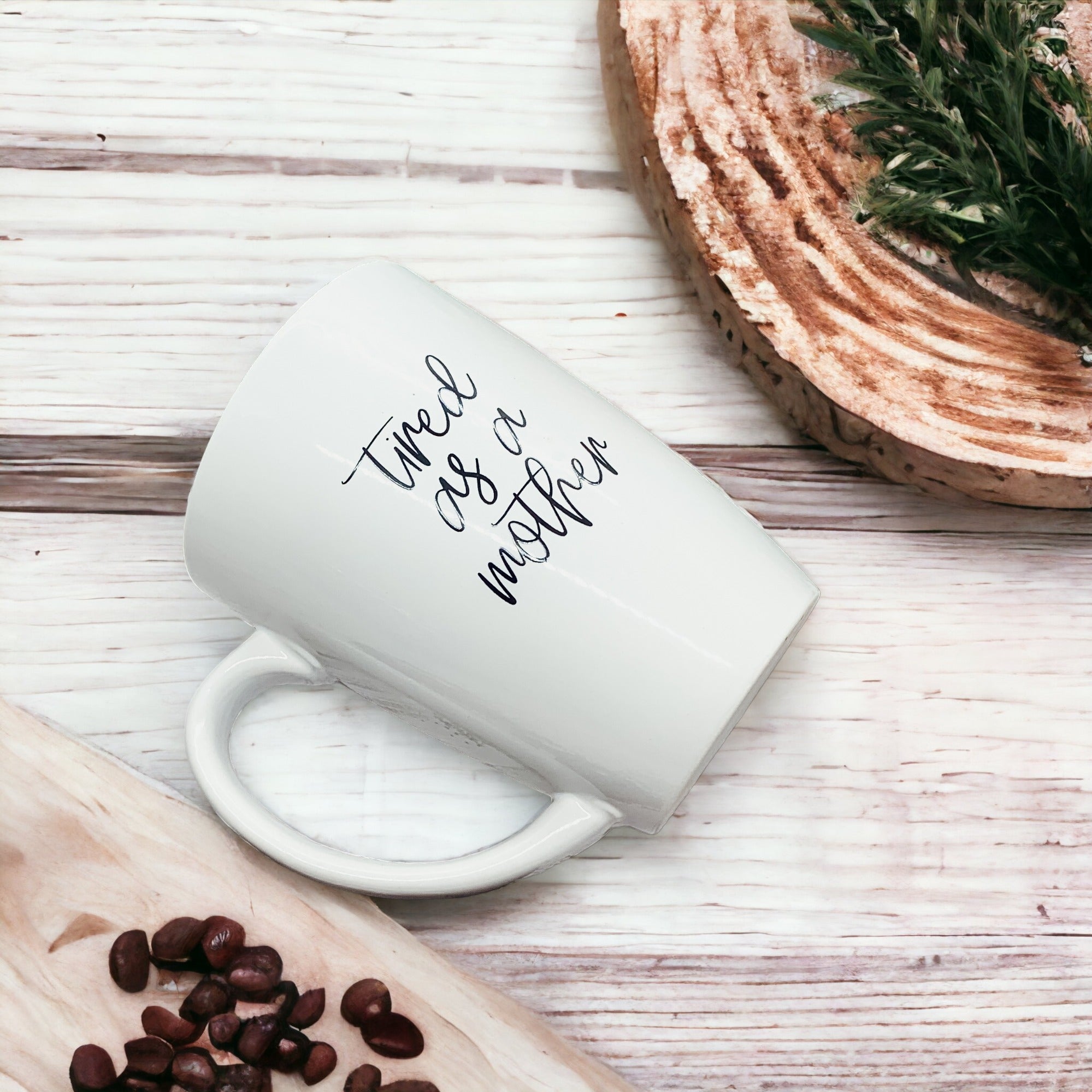 Tired as a Mother Grande mug in navy blue and white, featuring double-sided design with humorous text, perfect for mothers.