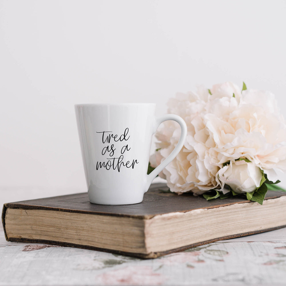 Tired as a Mother Grande mug in navy blue and white, featuring double-sided design with humorous text, perfect for mothers.