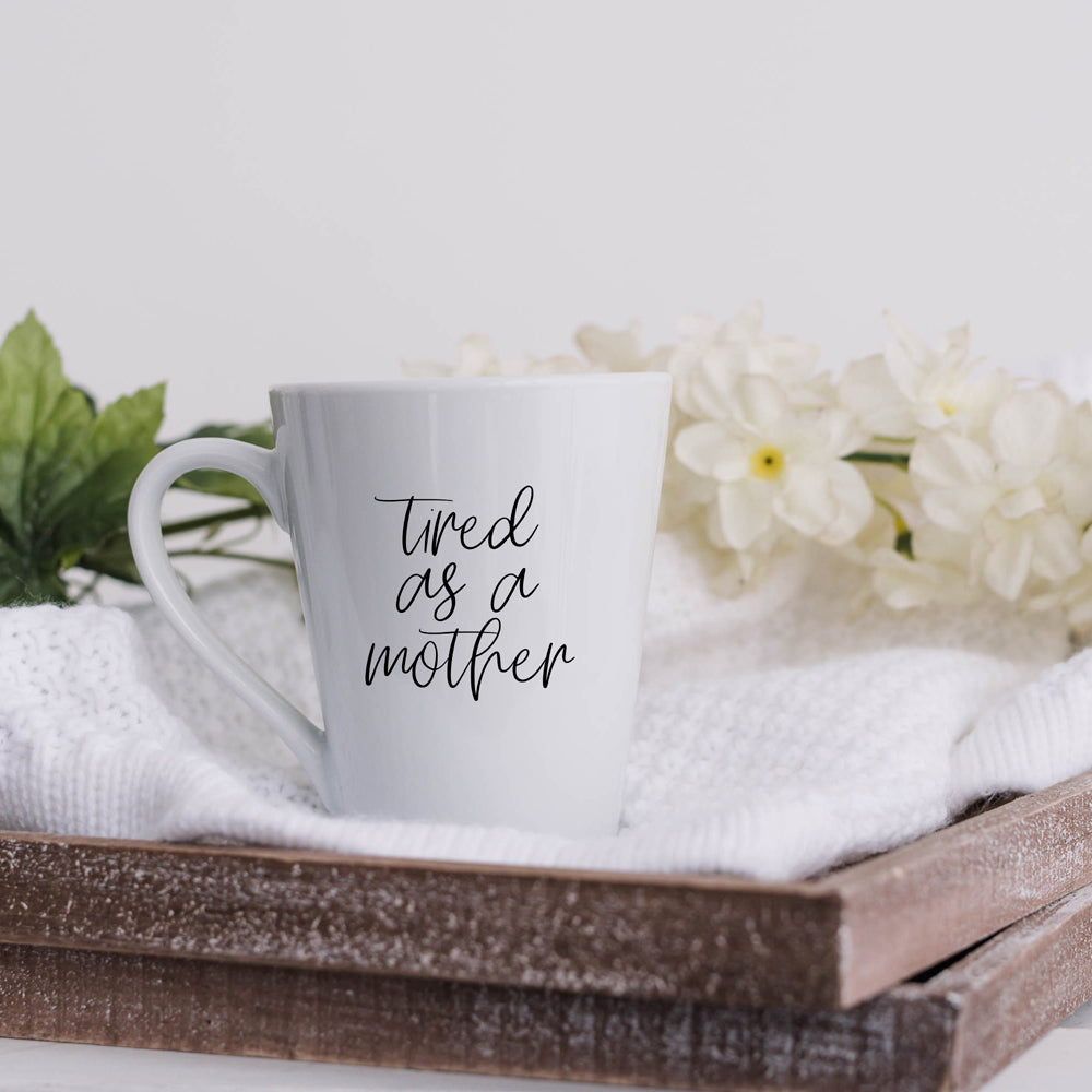 Tired as a Mother Grande mug in navy blue and white, featuring double-sided design with humorous text, perfect for mothers.