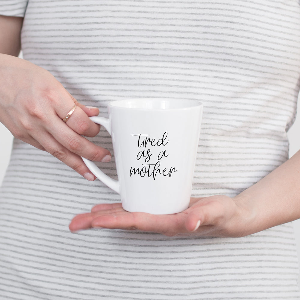 Tired as a Mother Grande mug in navy blue and white, featuring double-sided design with humorous text, perfect for mothers.