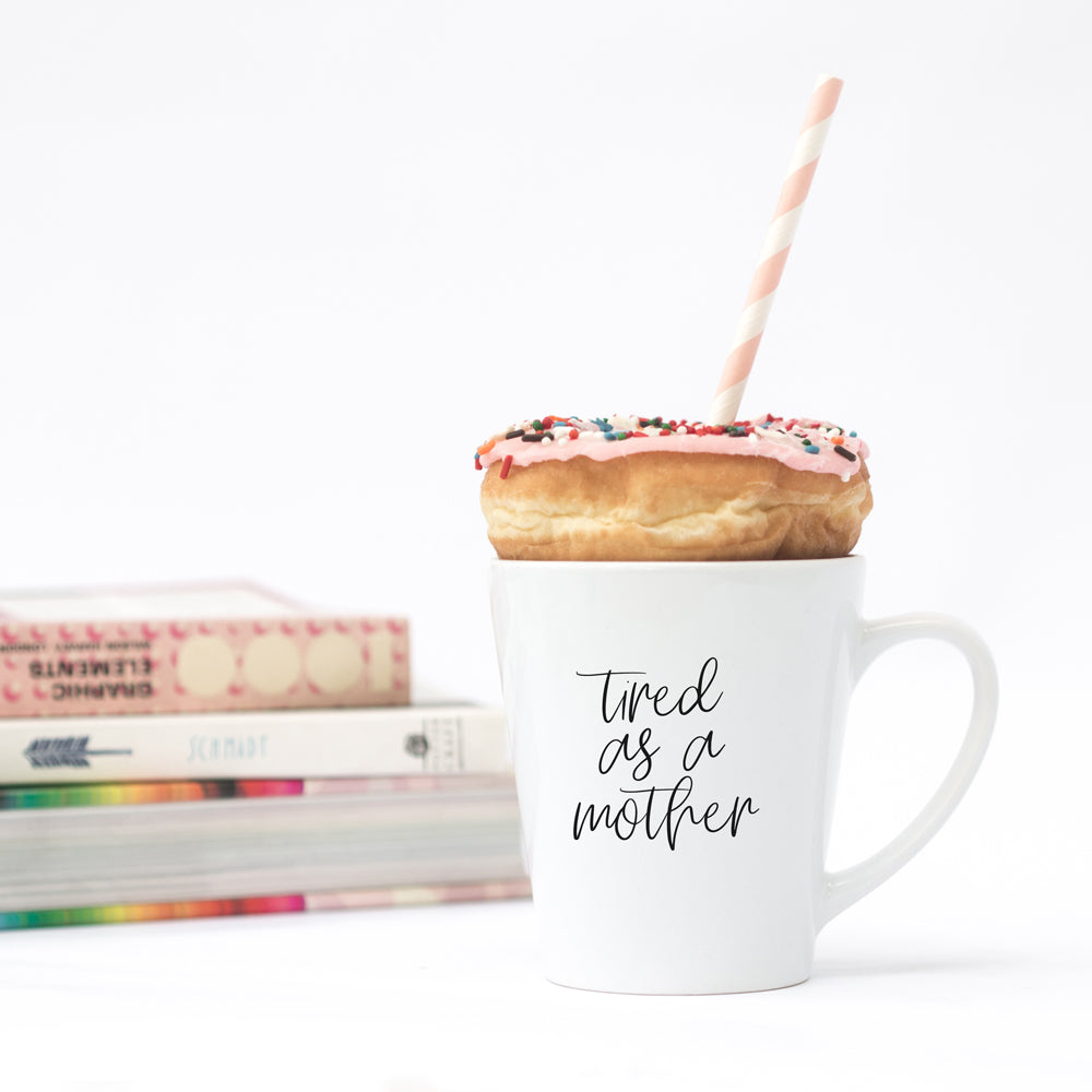 Tired as a Mother Grande mug in navy blue and white, featuring double-sided design with humorous text, perfect for mothers.