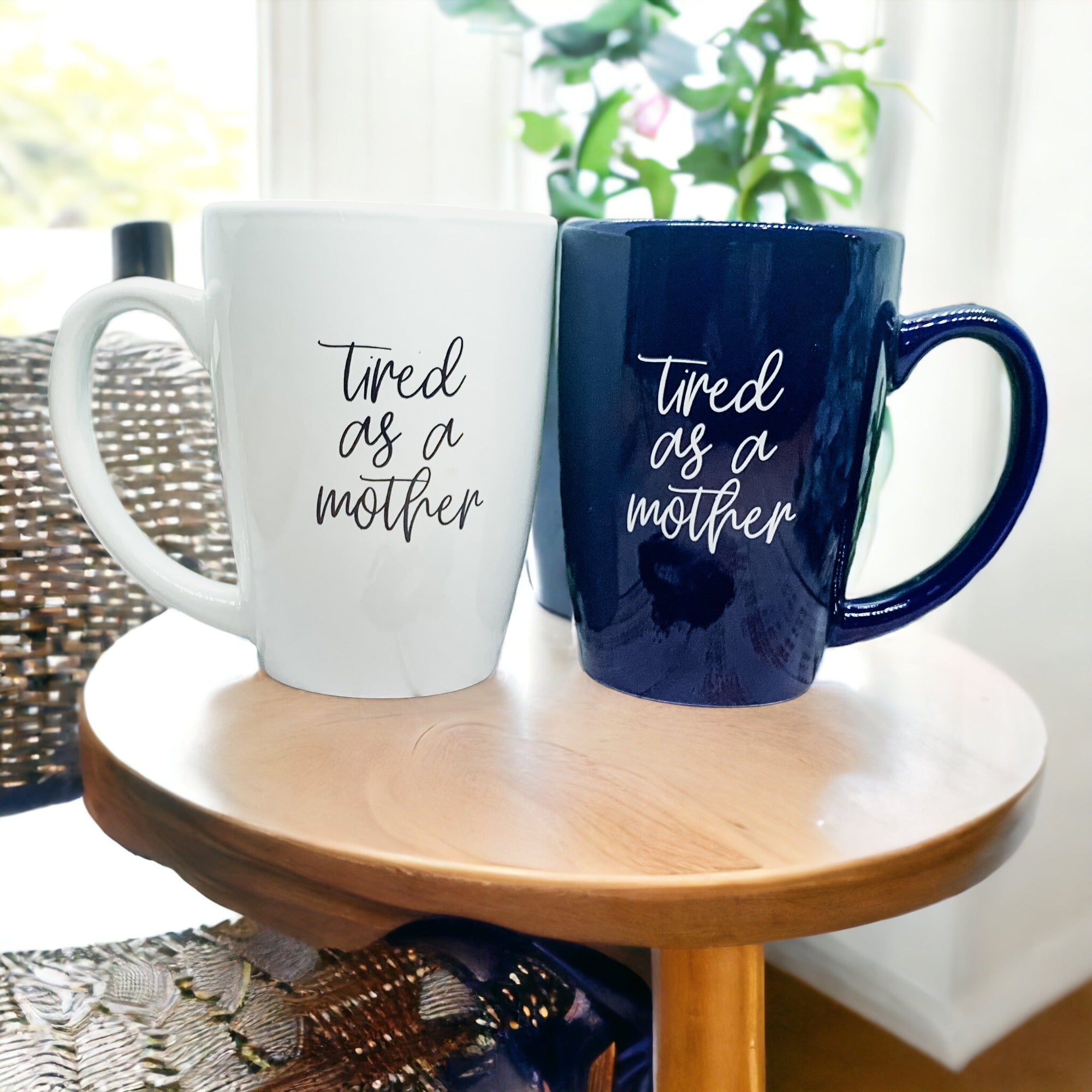 Tired as a Mother Grande mug in navy blue and white, featuring double-sided design with humorous text, perfect for mothers.