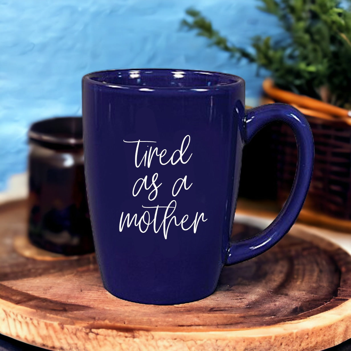 Tired as a Mother Grande mug in navy blue and white, featuring double-sided design with humorous text, perfect for mothers.