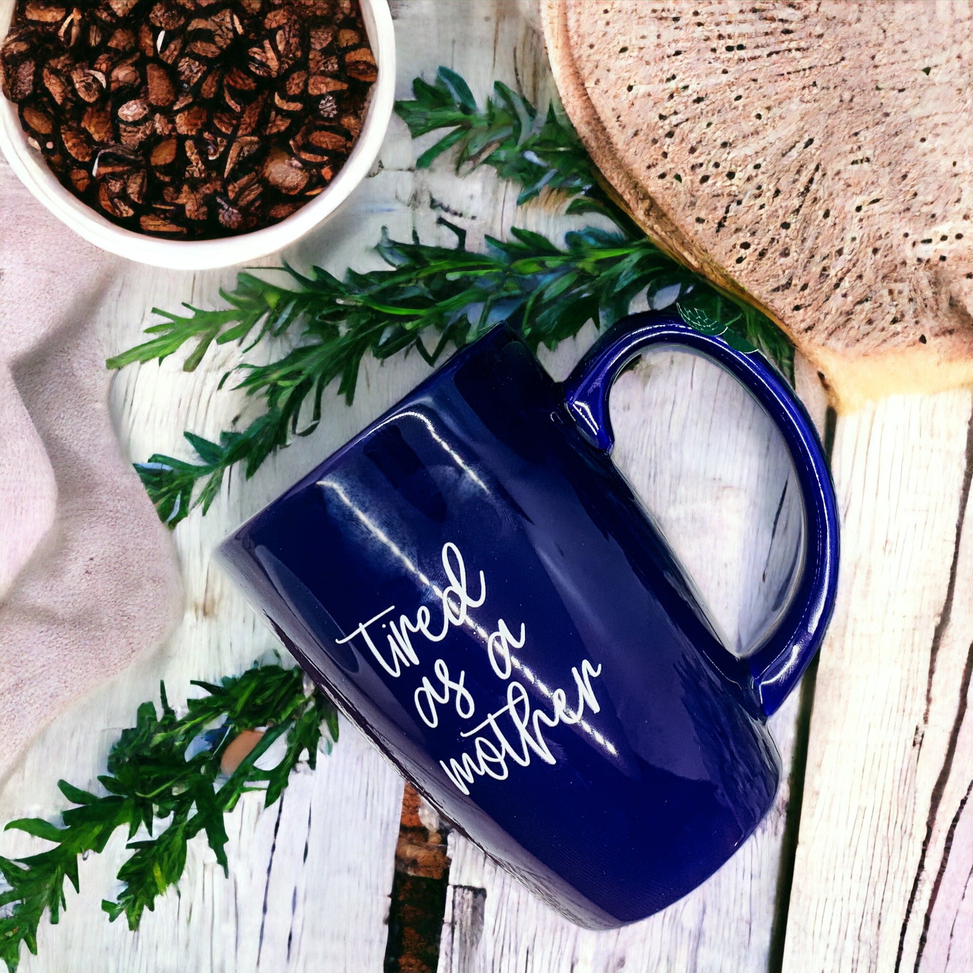 Tired as a Mother Grande mug in navy blue and white, featuring double-sided design with humorous text, perfect for mothers.