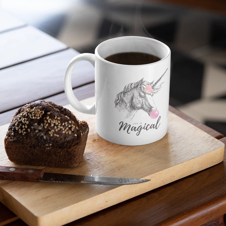 A whimsical Unicorn Bubble Gum Life is Magical Mug featuring a colorful unicorn design, perfect for coffee and tea lovers.