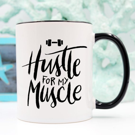 Hustle For The Muscle funny coffee mug featuring a humorous fitness design, perfect for coffee lovers and gym enthusiasts.