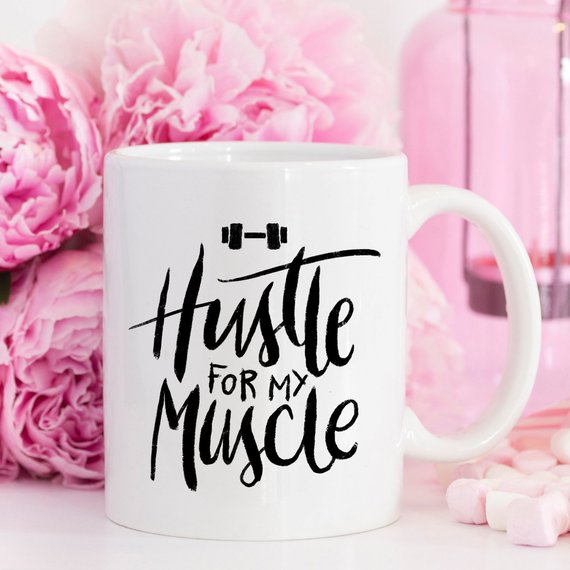 Hustle For The Muscle funny coffee mug featuring a humorous fitness design, perfect for coffee lovers and gym enthusiasts.