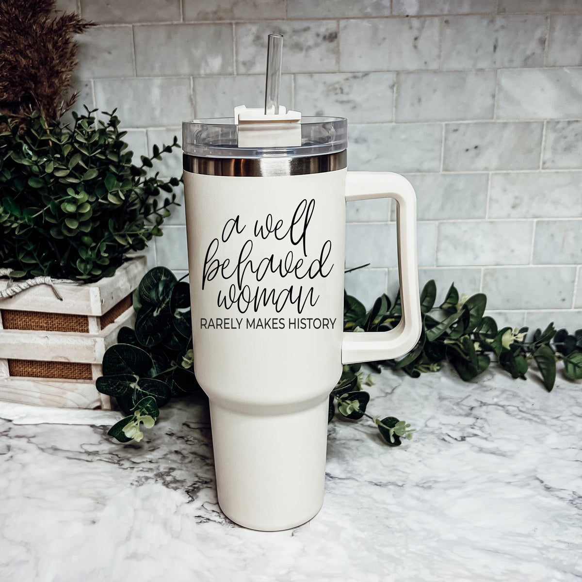 Well Behaved Woman 40oz insulated mug with a matte cream finish, featuring a black graphic design and a versatile 3-in-1 lid.