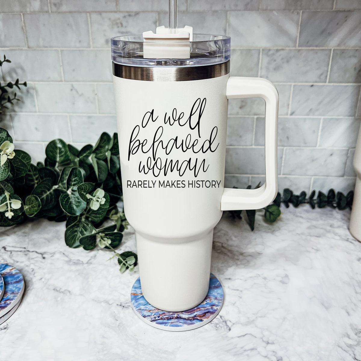 Well Behaved Woman 40oz insulated mug with a matte cream finish, featuring a black graphic design and a versatile 3-in-1 lid.