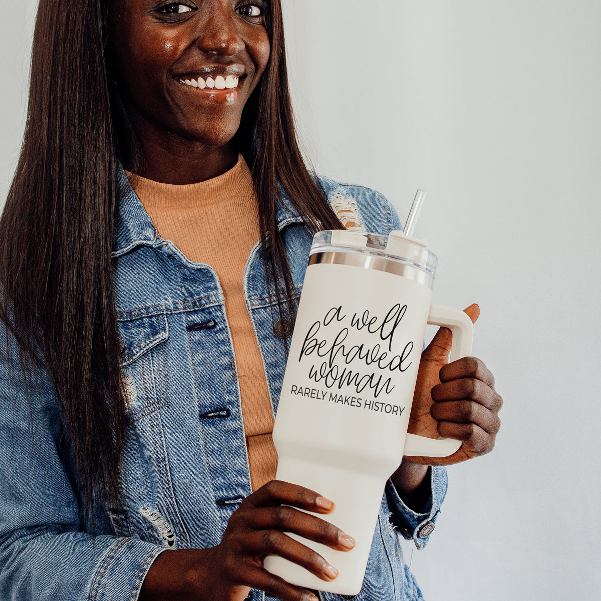 Well Behaved Woman 40oz insulated mug with a matte cream finish, featuring a black graphic design and a versatile 3-in-1 lid.