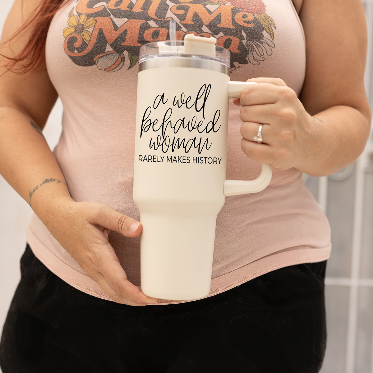 Well Behaved Woman 40oz insulated mug with a matte cream finish, featuring a black graphic design and a versatile 3-in-1 lid.