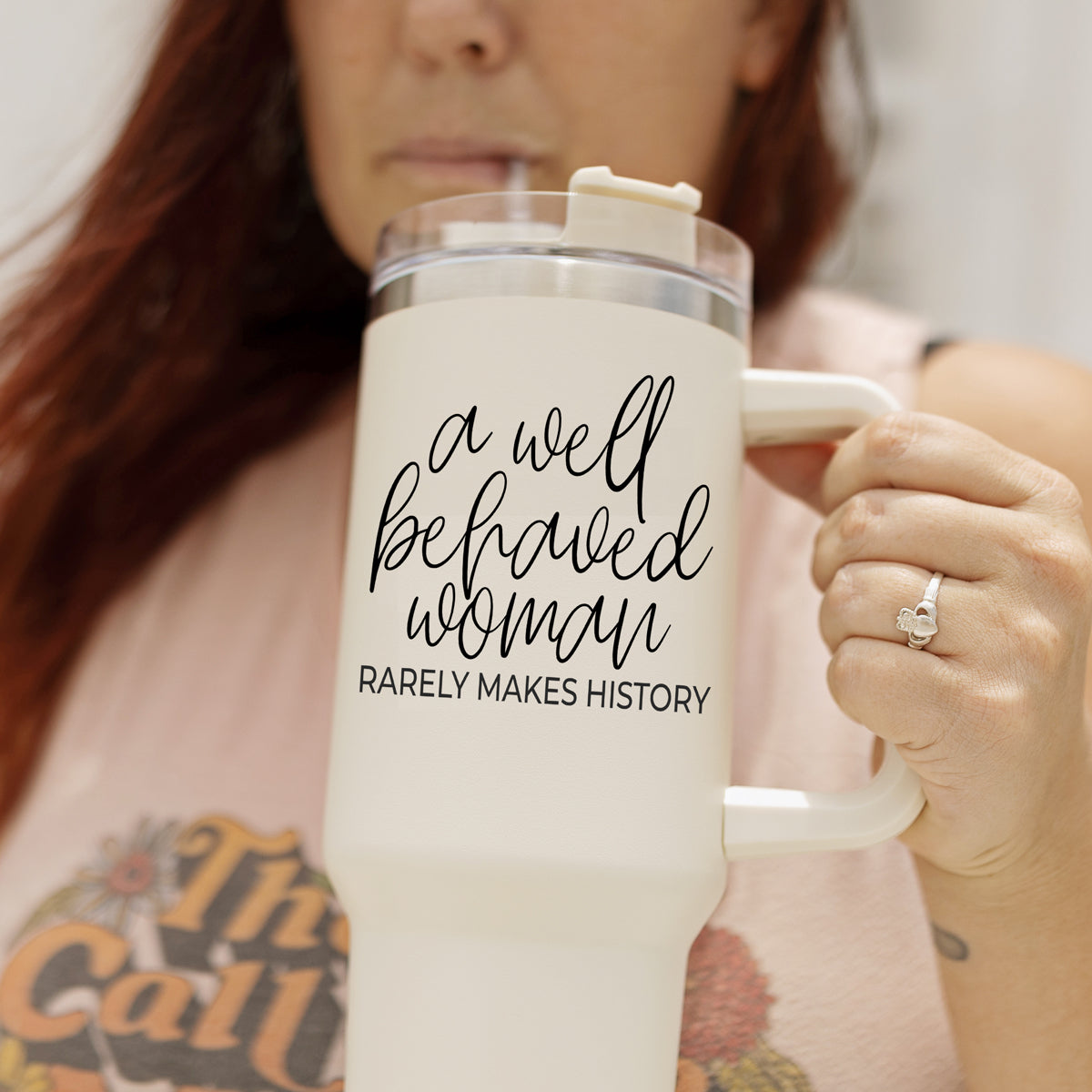 Well Behaved Woman 40oz insulated mug with a matte cream finish, featuring a black graphic design and a versatile 3-in-1 lid.