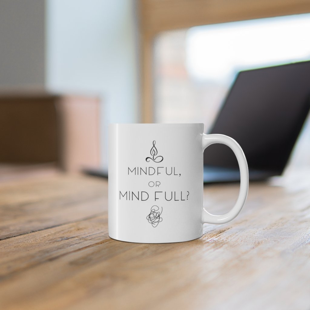 A white ceramic mug with the phrase 'Mindful or Mind Full' designed for yoga enthusiasts, featuring a C-Handle and rounded corners.