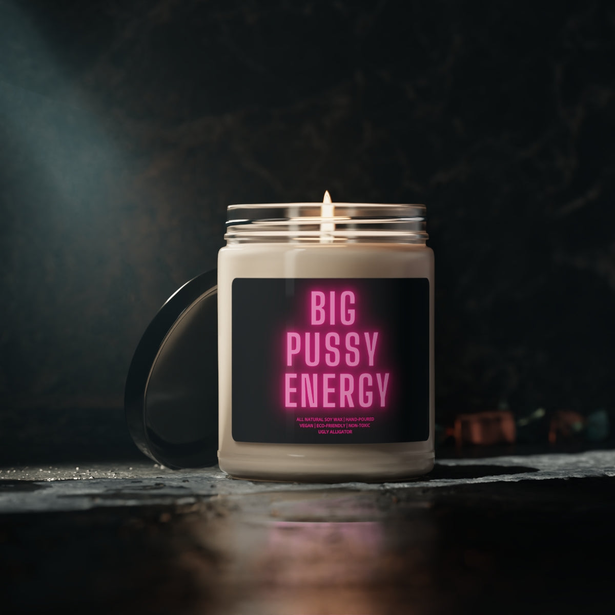 Big Pussy Energy Soy Candle in a stylish glass jar, showcasing its bold design and vibrant aroma.