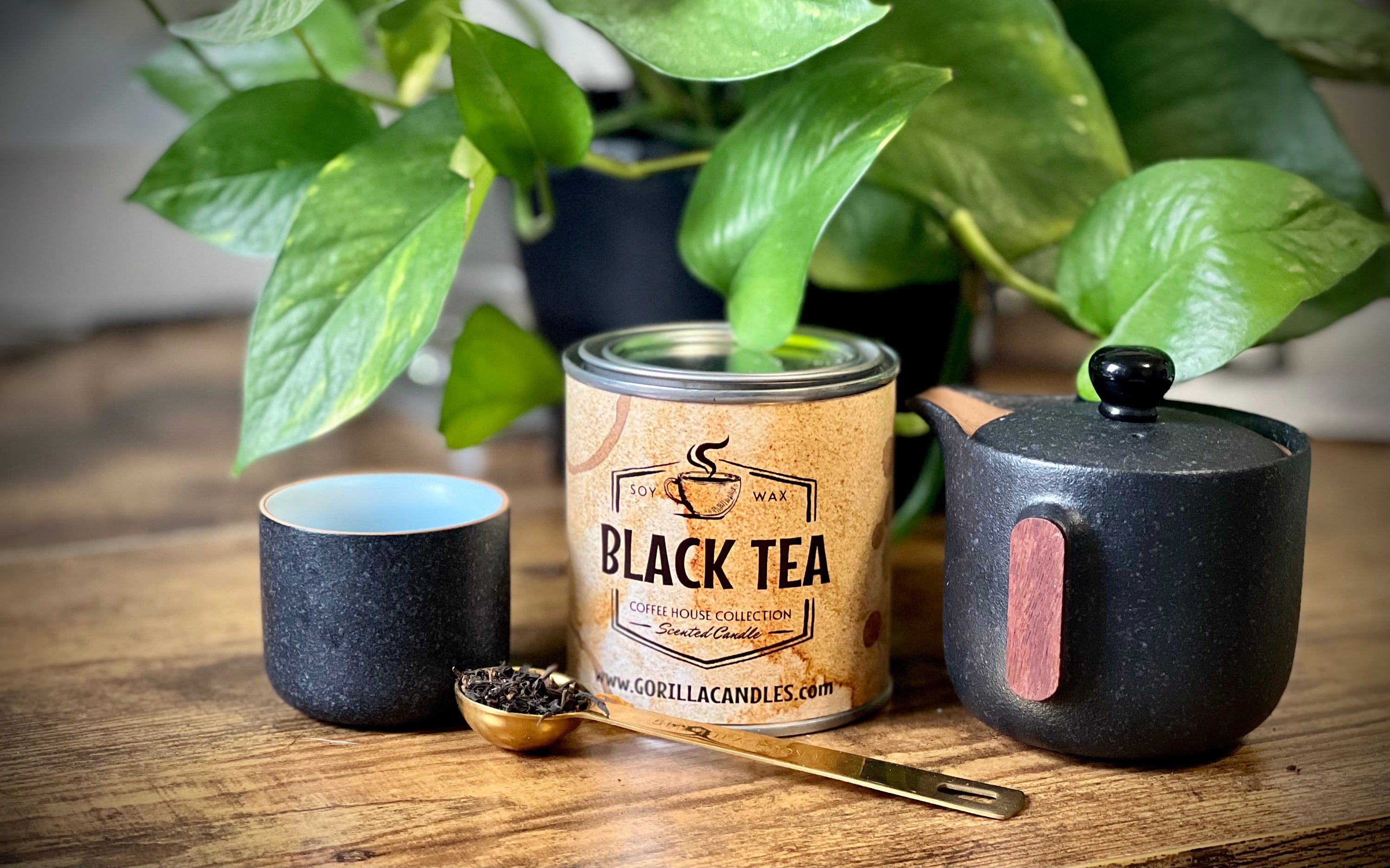 A stylish black tea scented candle in a 1/2 pint paint can, showcasing its elegant design and natural soy wax.