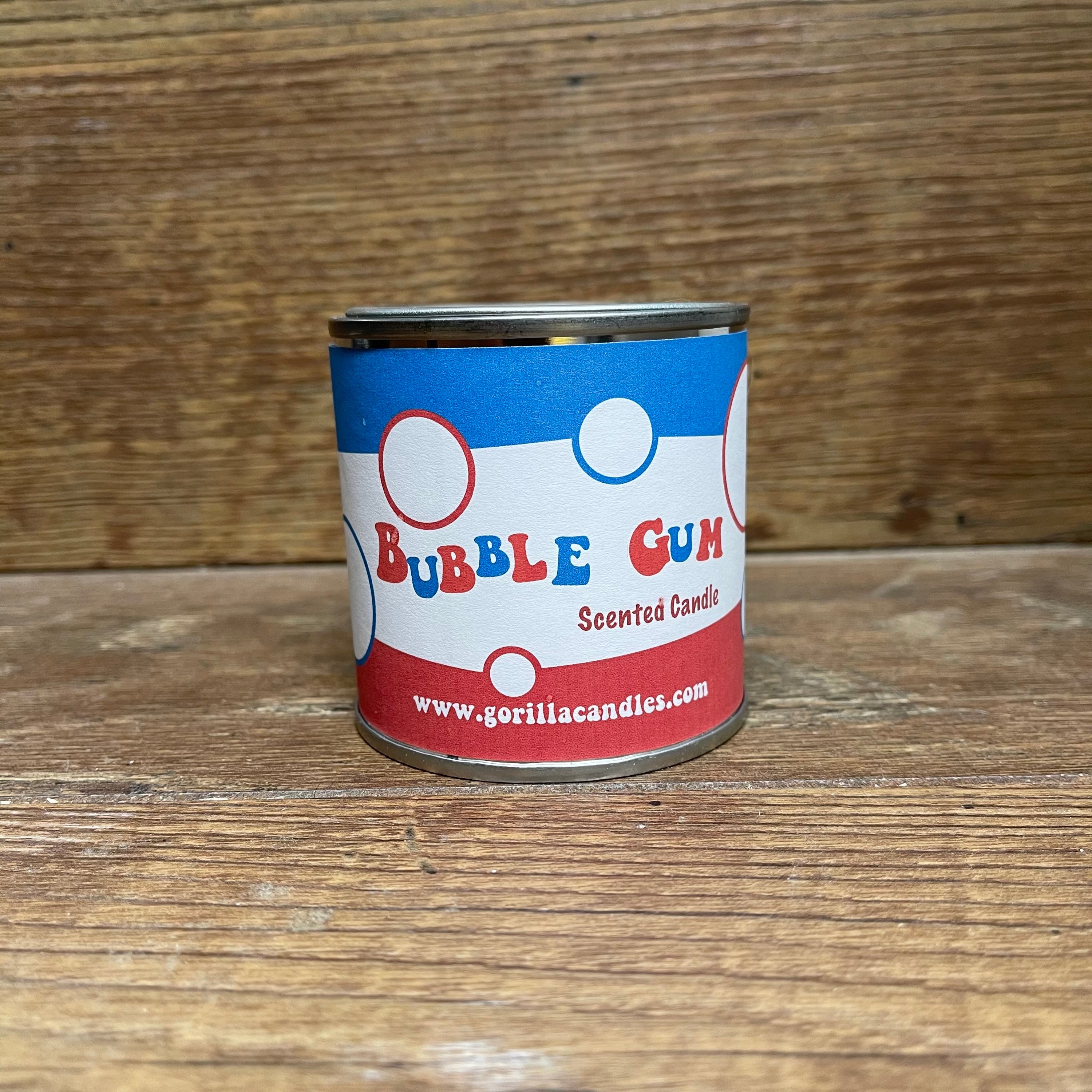 A retro-style paint can candle filled with soy wax, emitting a sweet Bazooka Bubble Gum scent.