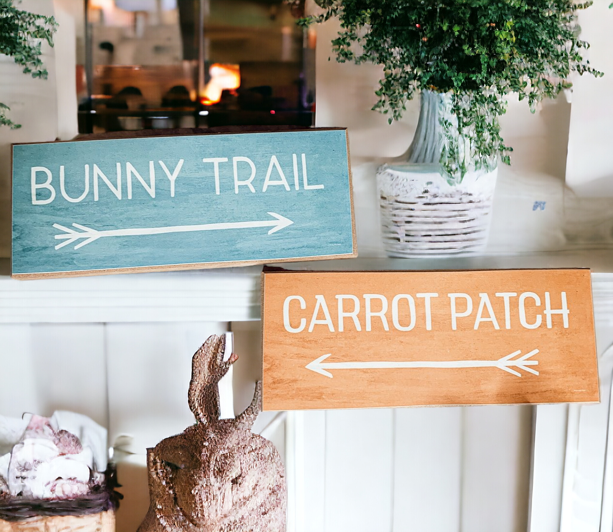 Two wooden block signs featuring Bunny Trail and Carrot Patch designs in pastel colors, perfect for Easter decor.