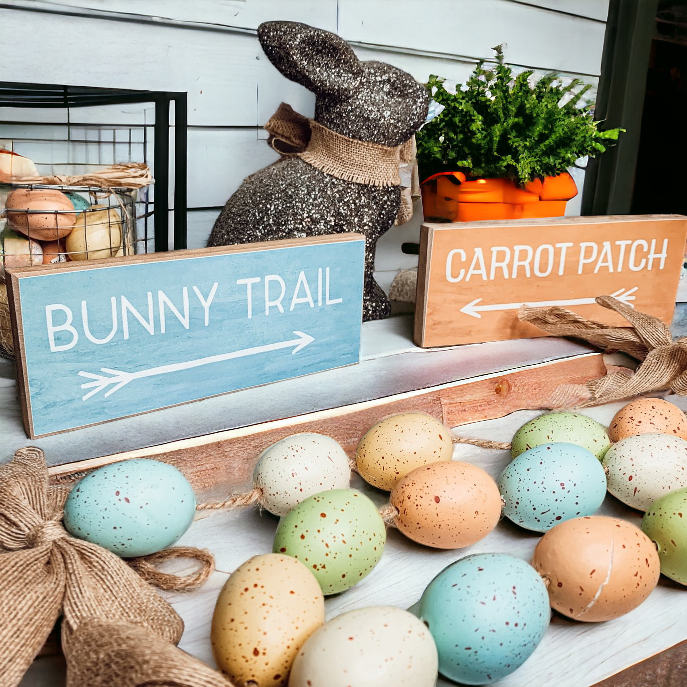 Two wooden block signs featuring Bunny Trail and Carrot Patch designs in pastel colors, perfect for Easter decor.