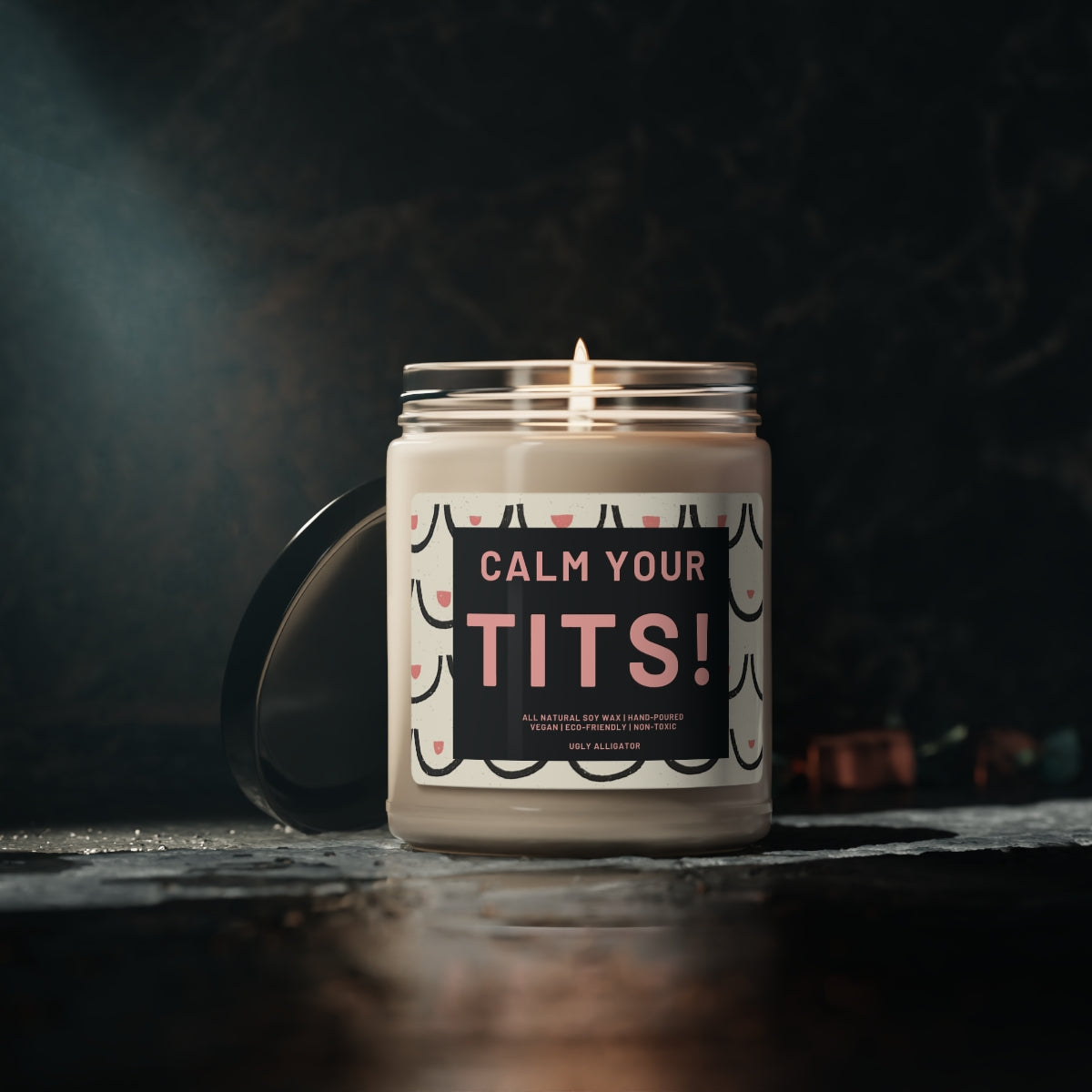 Calm Your Tits Soy Candle in a stylish glass jar, showcasing its natural soy wax and cotton wick.