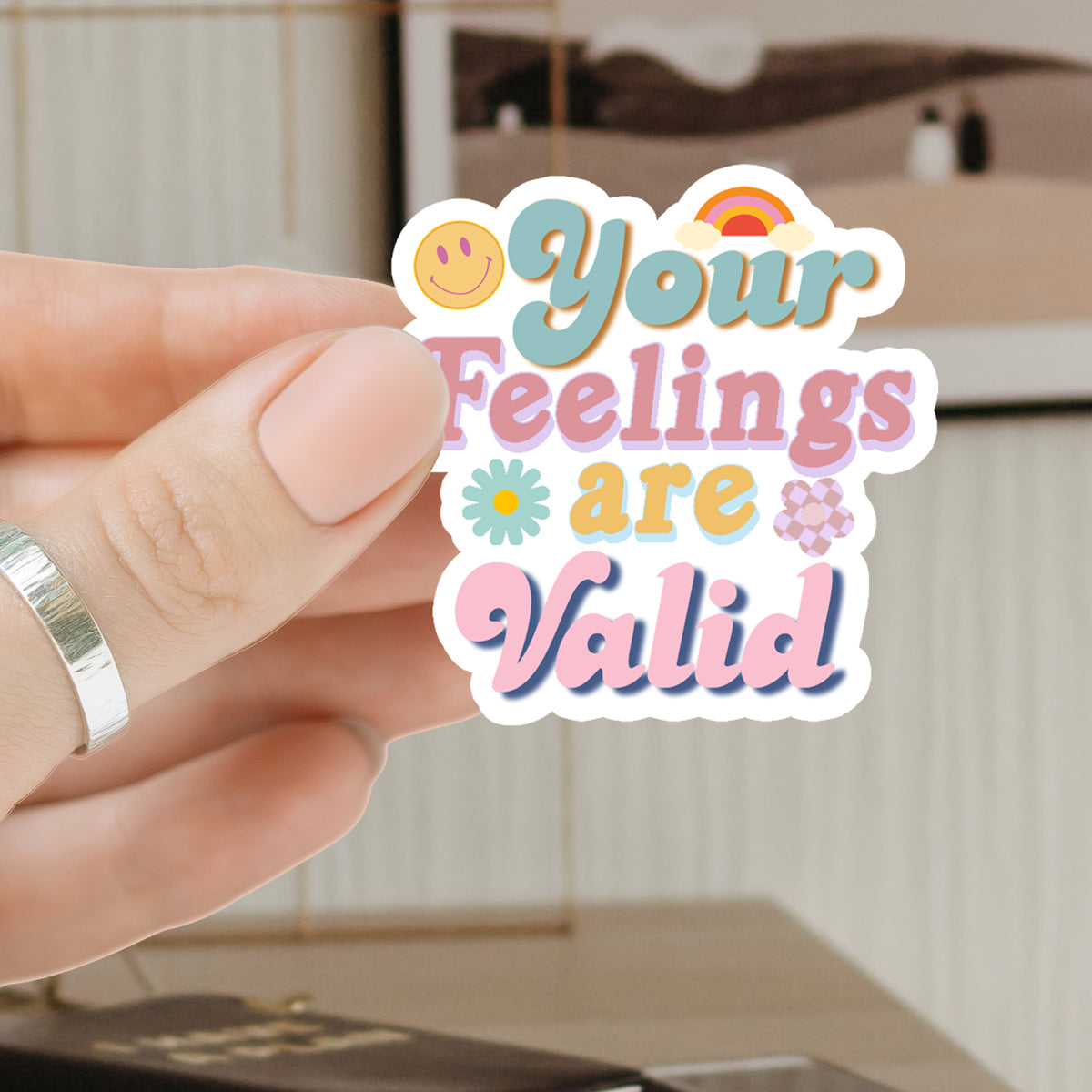 A collection of colorful 'Feelings are Valid' vinyl stickers showcasing unique designs, perfect for personalizing various items.