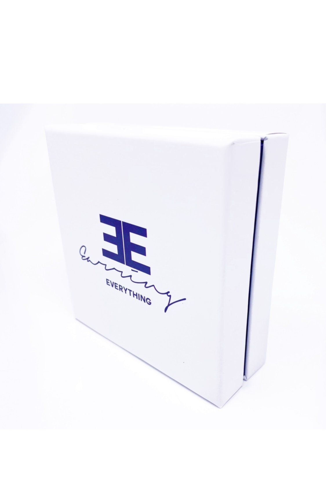 Elegant white monogrammed gift box with purple velvet inset, perfect for personalized gifting.