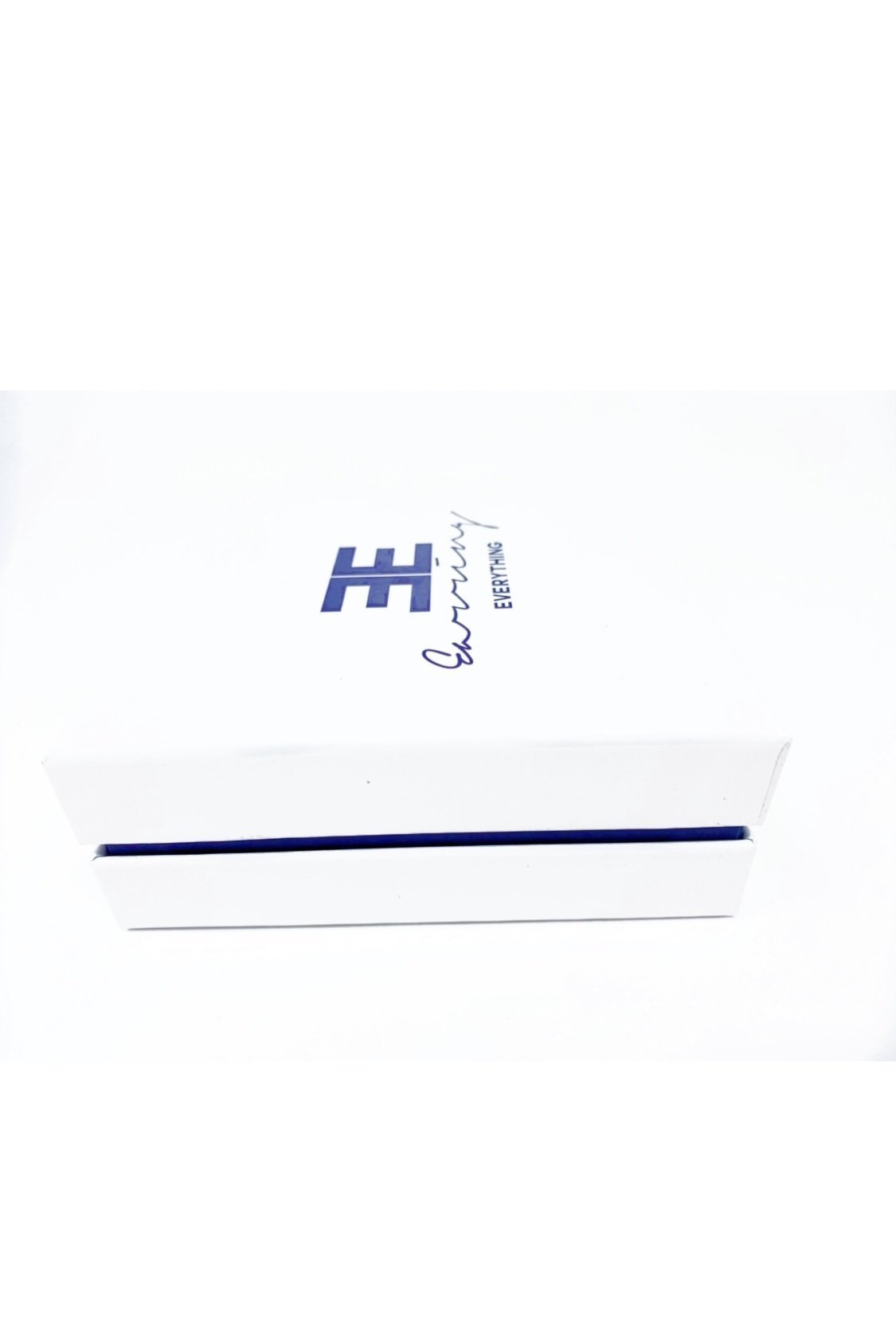 Elegant white monogrammed gift box with purple velvet inset, perfect for personalized gifting.