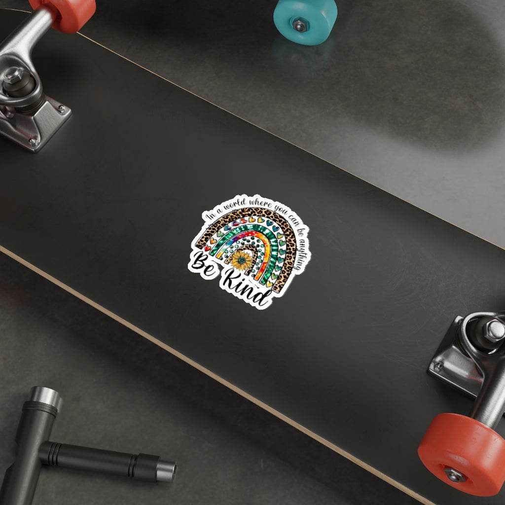 A collection of colorful die-cut stickers showcasing various custom designs on a smooth surface.