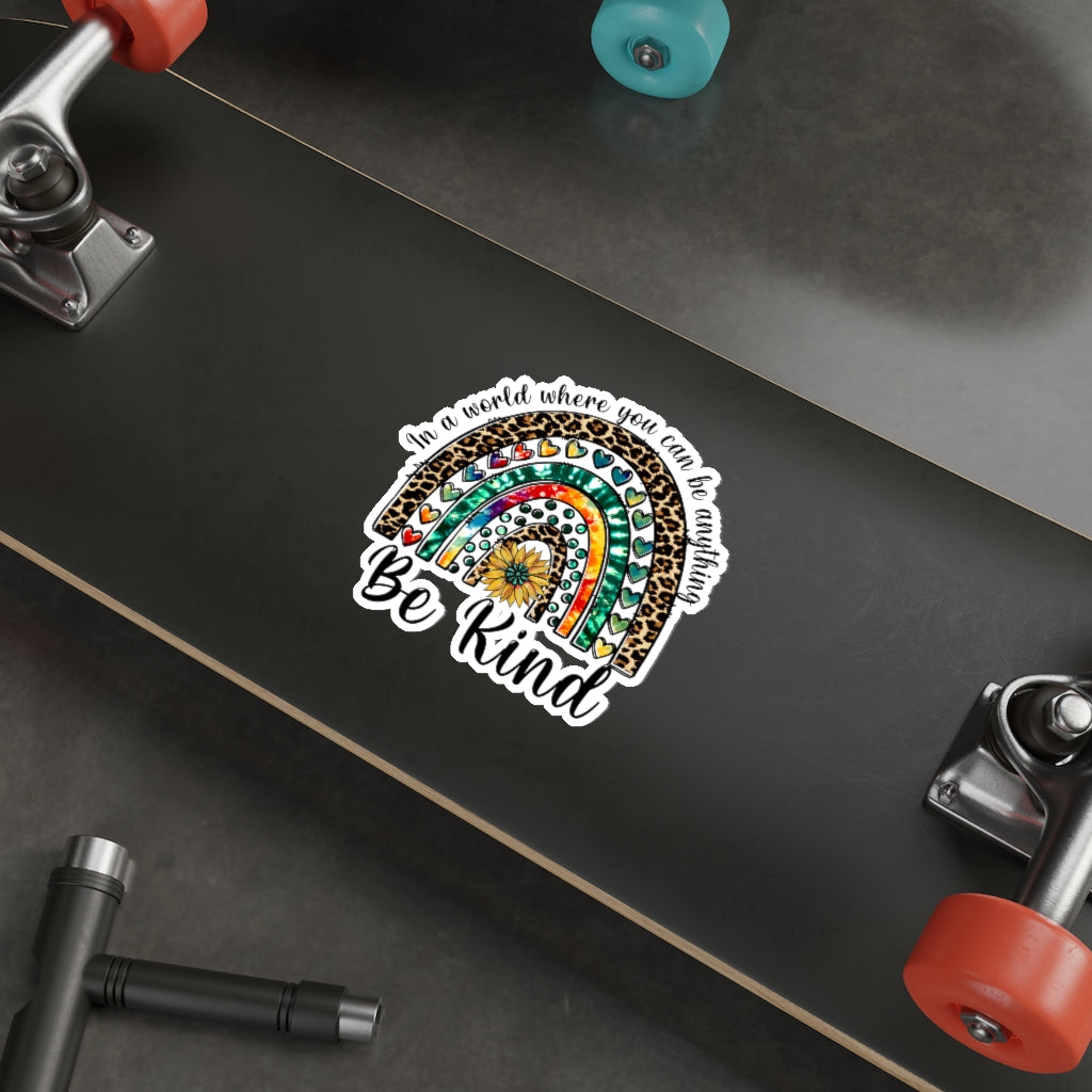 A collection of colorful die-cut stickers showcasing various custom designs on a smooth surface.