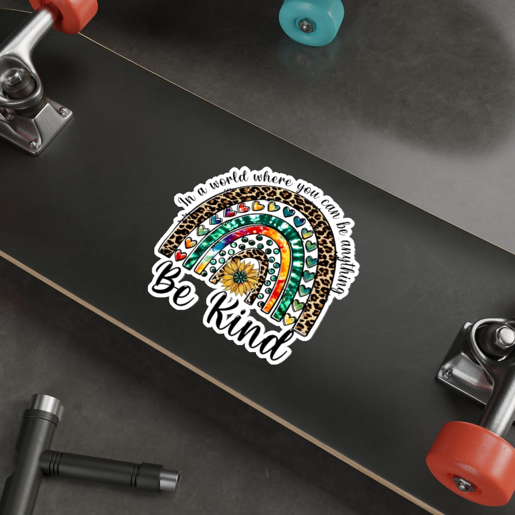 A collection of colorful die-cut stickers showcasing various custom designs on a smooth surface.