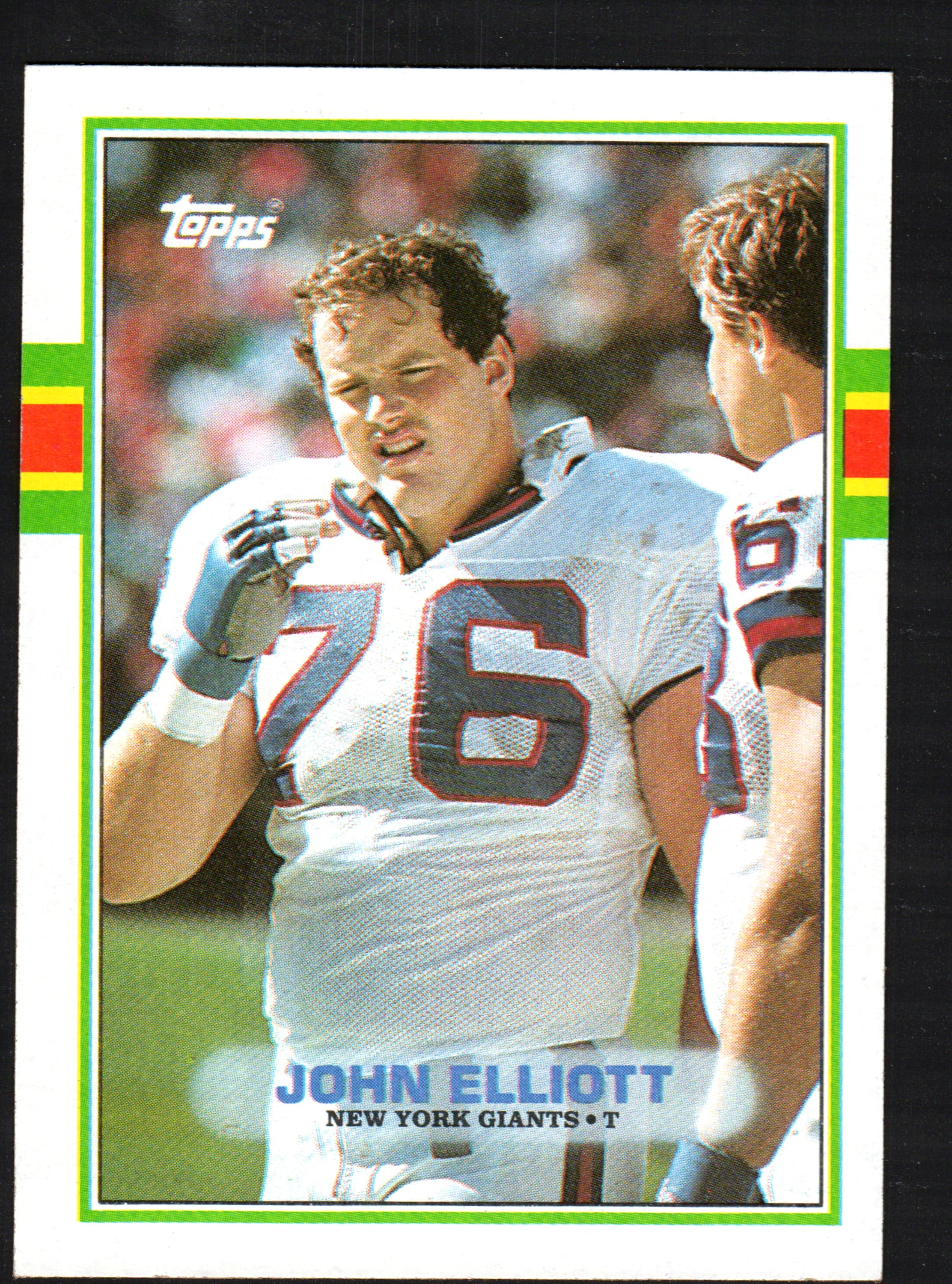 1989 Topps trading card featuring John Elliott of the New York Giants, card number 179, showcasing vibrant colors and detailed player information.