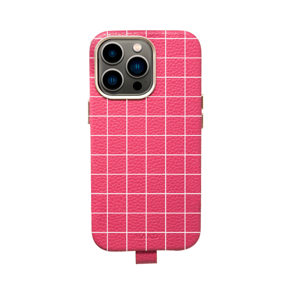 MAAD Full Wrapped Hot Pink Grid iPhone 13 Pro case featuring vegan leather and gold pleated edges, showcasing a trendy design.