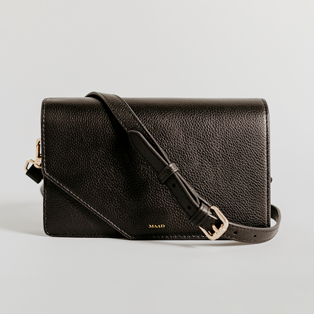 Match - Black Asymmetric Crossbody bag made of smooth pebble leather with an adjustable strap and interior cardholder.