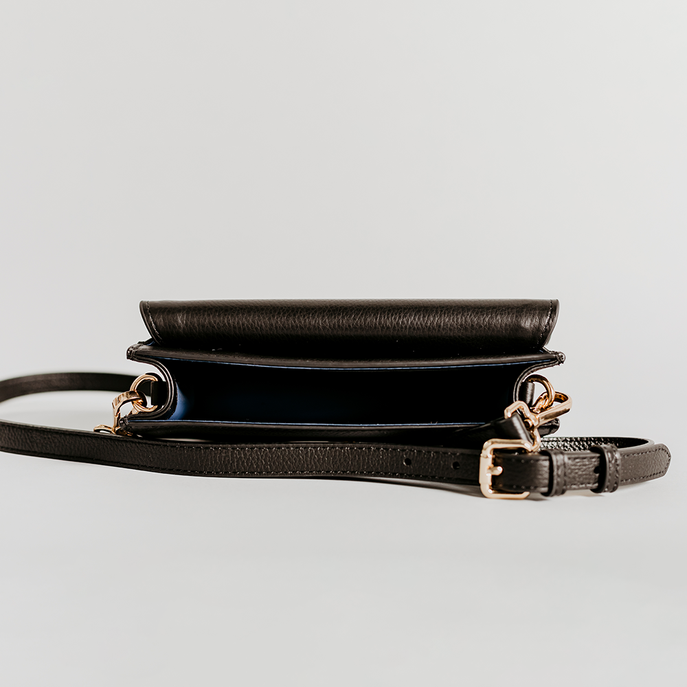 Match - Black Asymmetric Crossbody bag made of smooth pebble leather with an adjustable strap and interior cardholder.