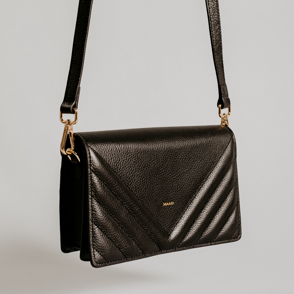 Match Black Quilted Crossbody bag made of smooth pebble leather with an adjustable strap and interior cardholder.