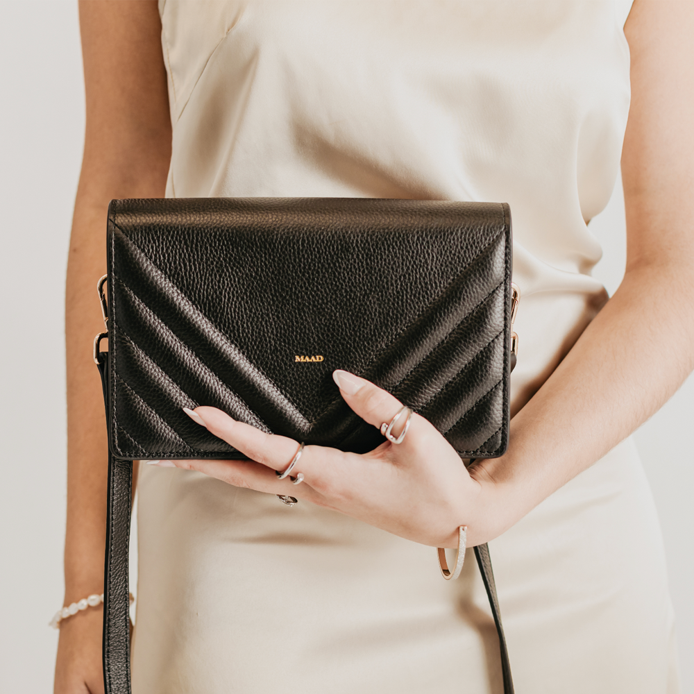 Match Black Quilted Crossbody bag made of smooth pebble leather with an adjustable strap and interior cardholder.