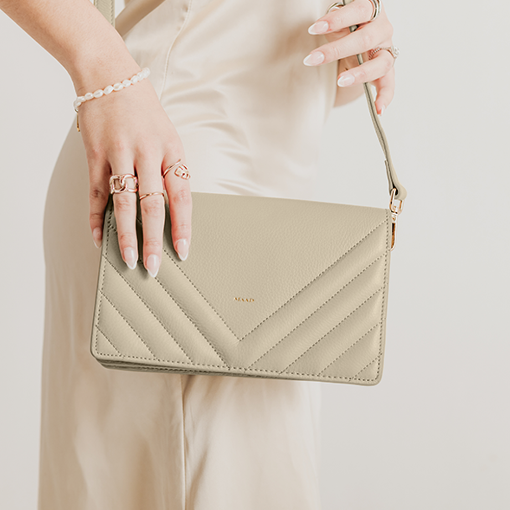 Match Grey Quilted Crossbody bag made of smooth pebble leather with an adjustable strap and interior cardholder.