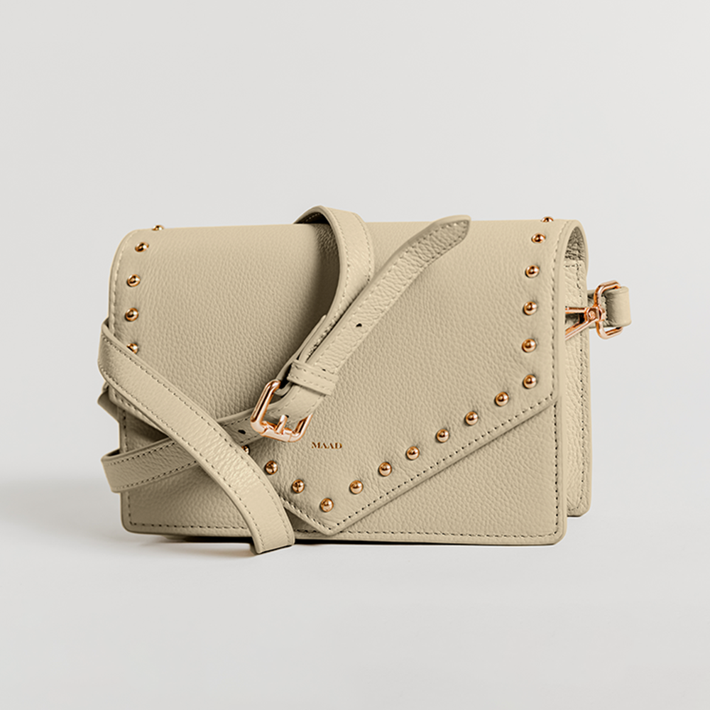 Match Grey Studs Crossbody bag made of smooth pebble leather with adjustable strap and interior cardholder.