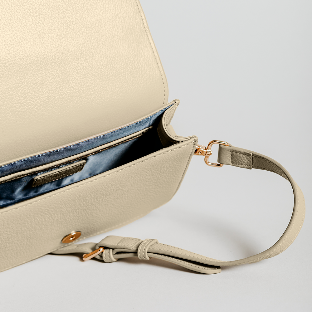 Match Grey Studs Crossbody bag made of smooth pebble leather with adjustable strap and interior cardholder.