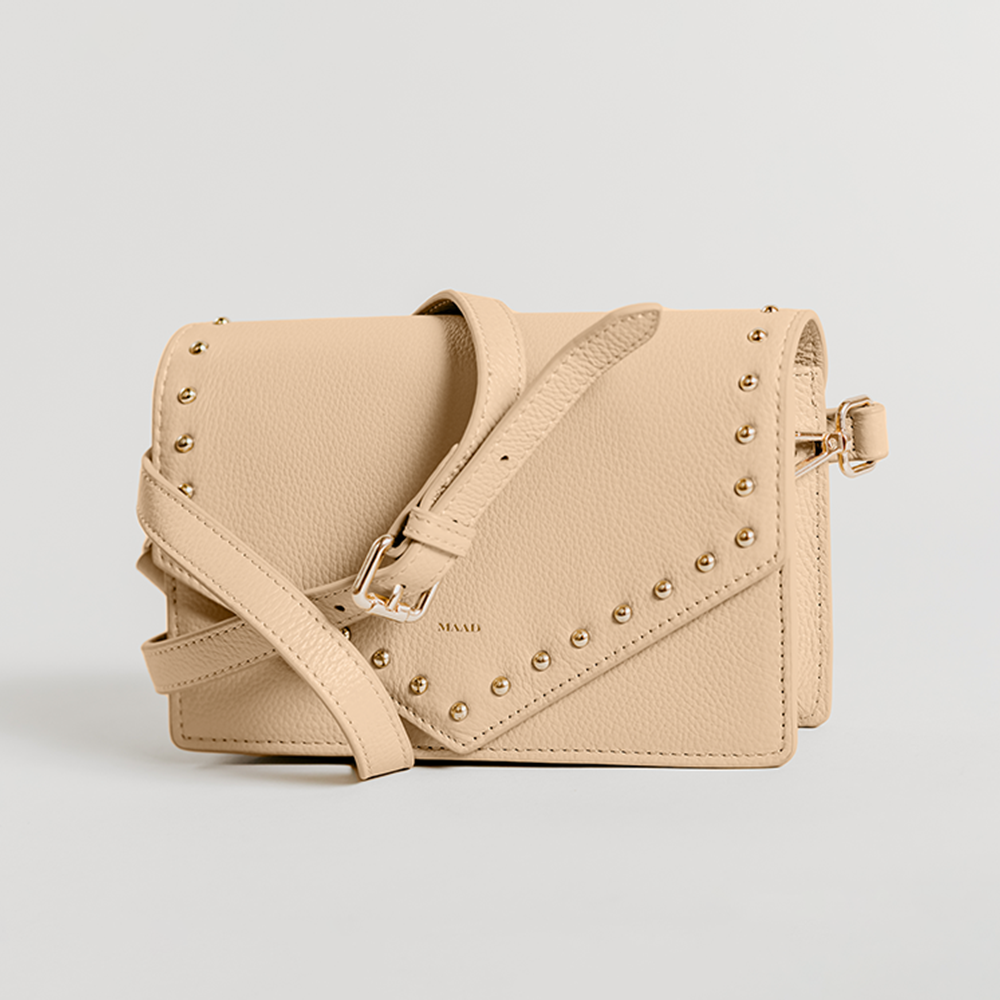 Match Sandy Nude Studs Crossbody bag featuring smooth pebble leather and adjustable strap.